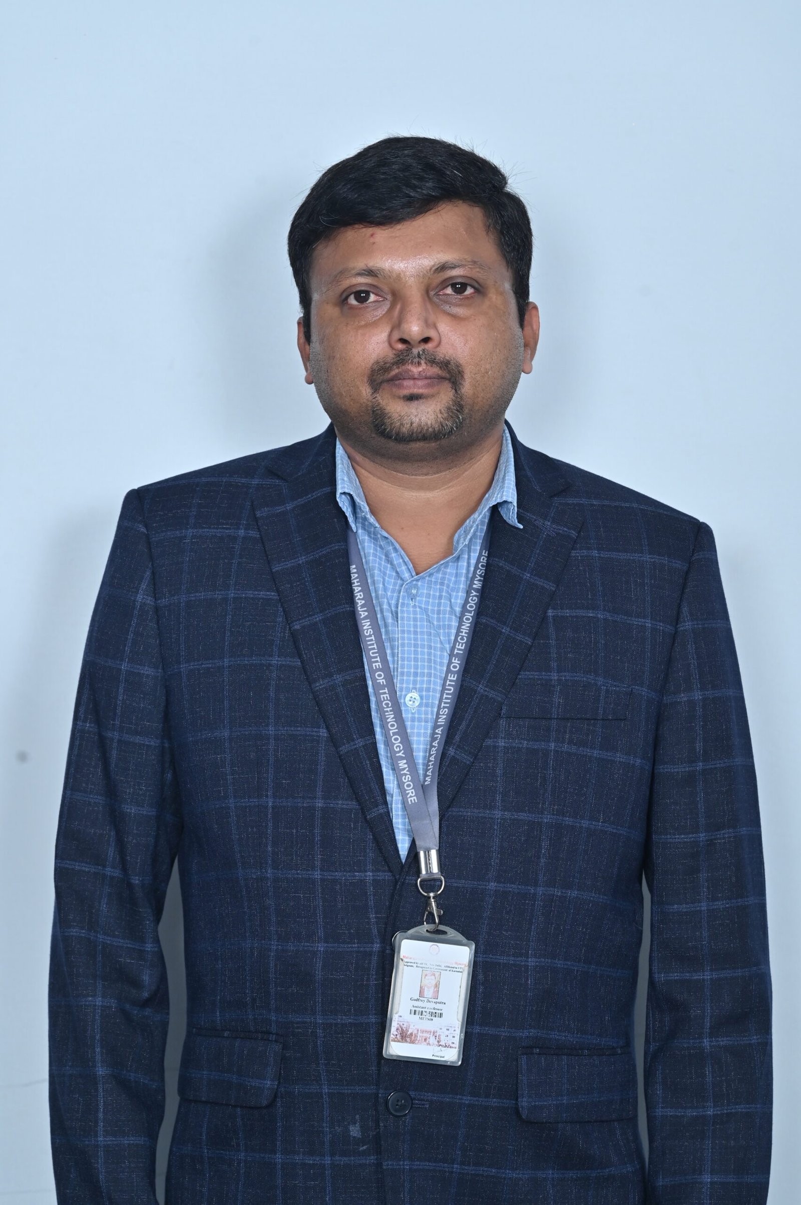 Dr. Godfrey Devaputra