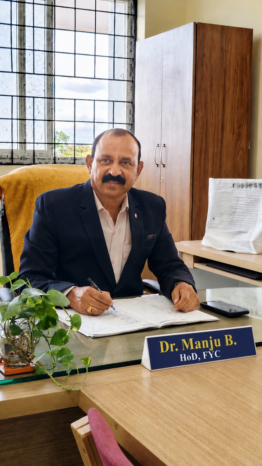 Dr. Manju B